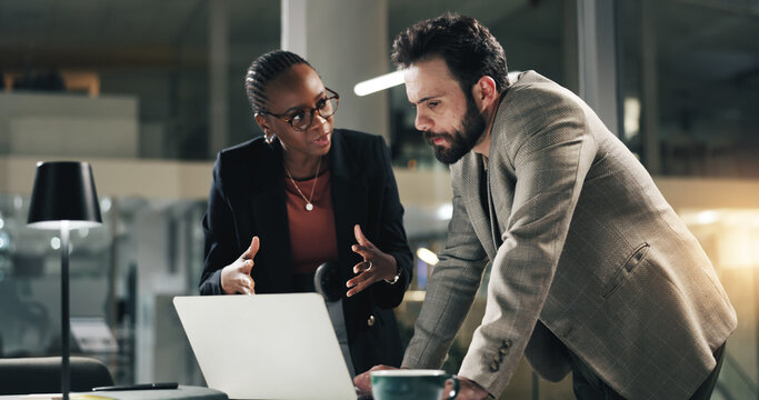 Discussion, night and business people on laptop for review meeting, planning and proposal deadline. Corporate office, working late and woman with man on tech for research, budget and financial report - Powered by Adobe