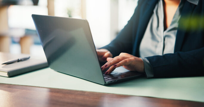 Business woman, hands on laptop and typing with email response or bank loan application for finance in office. Computer, writing and feedback for credit, account and financial consultant at desk