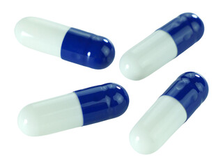 Bulk blue and white capsule pills isolated on white background.