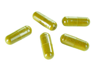 Bulk green herbal capsule pills isolated on white background.