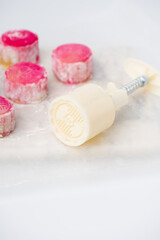 Homemade Chinese snow skin mooncakes. Snowy Moon cakes on a White Background. Mid-Autumn Festival, traditional Asian desserts, and seasonal celebrations in Asian countries