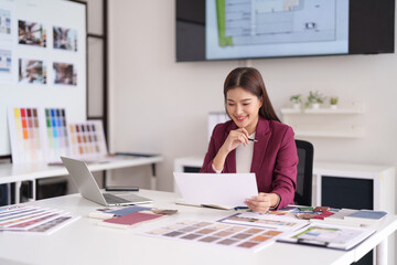 Asian Woman Architect Professional Reviewing House Design Plans Material Samples Bright Modern Office Creating Home Concepts