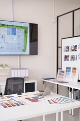 Architectural interior designer office workspace displaying floor plan on screen project planning creative design studio modern professional environment