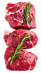 Obraz premium Stacked Fresh Red Raw Beef Steaks with Rosemary and Pepper on White Background