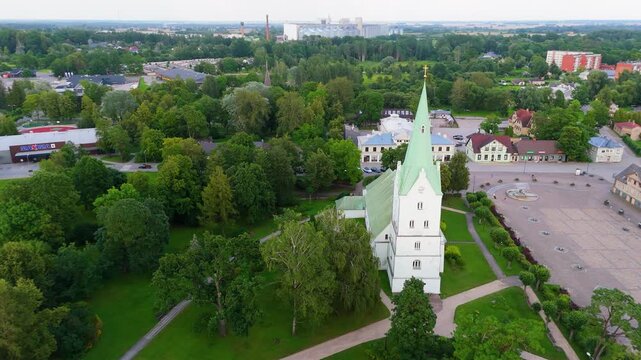 Aerial Panorama of Dobele Town Center and Evangelical Lutheran Church at Summer Scenic Drone View in Golden Hour Light Over Dobeles Historic Center on a Warm Summer Evening Peaceful Latvian Town