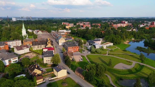 Aerial Panorama of Dobele Town Center and Evangelical Lutheran Church at Summer Scenic Drone View in Golden Hour Light Over Dobeles Historic Center on a Warm Summer Evening Peaceful Latvian Town