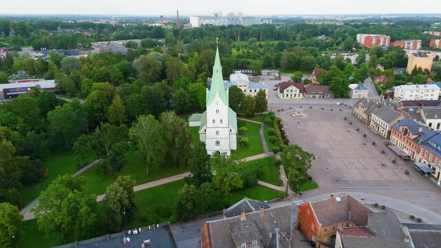 Aerial Panorama of Dobele Town Center and Evangelical Lutheran Church at Summer Scenic Drone View in Golden Hour Light Over Dobeles Historic Center on a Warm Summer Evening Peaceful Latvian Town