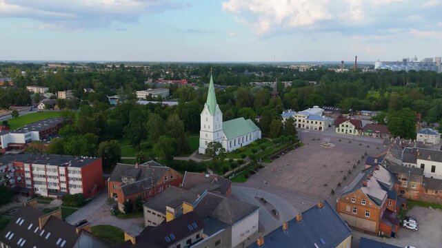 Aerial Panorama of Dobele Town Center and Evangelical Lutheran Church at Summer Scenic Drone View in Golden Hour Light Over Dobeles Historic Center on a Warm Summer Evening Peaceful Latvian Town