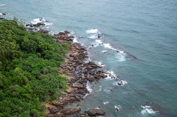 Aerial view of Phu Quoc's Hon Thom fishing port and coastline, captured from the scenic cable car route over turquoise waters