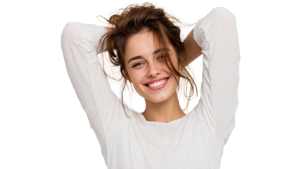 Happy woman with brown hair smiling, arms behind head, isolated on white background.