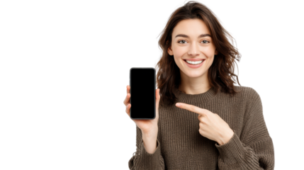 Happy young woman presenting smartphone, smiling, casual attire, isolated background.