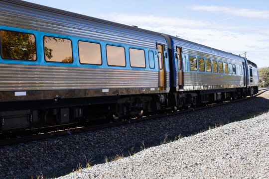Looking along train and tracks at a rural train station