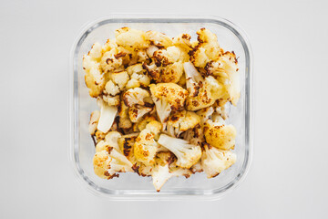 roasted cauliflower in glass container for healthy meal prep