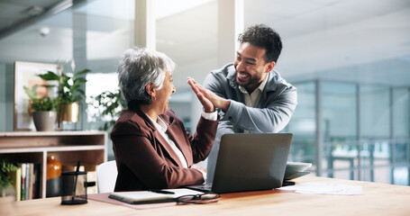 Business celebration, laptop and people with high five for trading success, sales goal or teamwork. Excited man, mature woman and tech with support in office for stock market growth and achievement