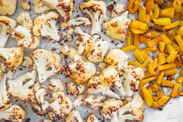 roasted cauliflower and yellow capsicum on baking tray