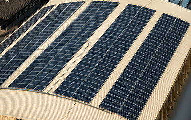 Fototapeta premium Varieties photovoltaic sheets or solar panels installing on building roof for alternative and clean energy