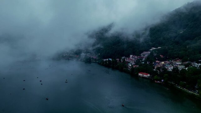 Aerial view of Naini lake, Boats on the Naini Lake in cloudy weather at Nainital, Uttarakhand, India