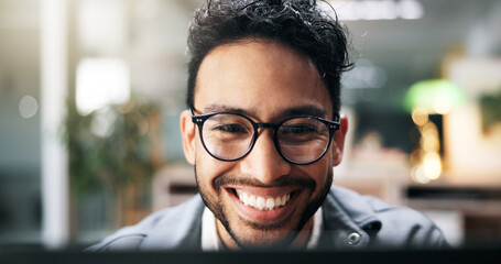 Smile, creative man and laptop in office for planning, proofreading story and editor feedback....