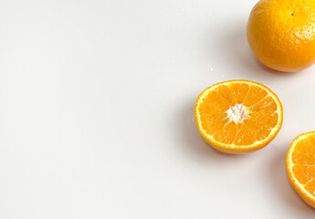 Slice of fresh and juicy oranges on white background. A burst of vitamin C and natural sweetness, ideal for breakfast menus or wellness-themed food photography. 