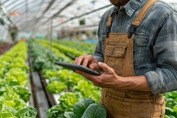 Farmer using tablet in greenhouse agriculture technology innovation