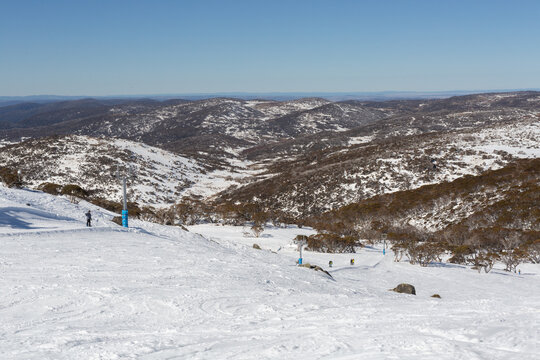 Alpine landscape with chair lift, native plants, slopes at Perisher, Snowy Mountains Australia
