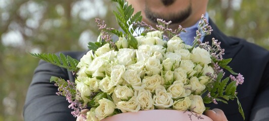 man with bouquet of flowers