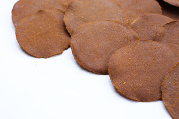 Fermented soybean discs, known as “Thua Nao,” a traditional Thai seasoning used to enhance flavor in Northern cuisine.