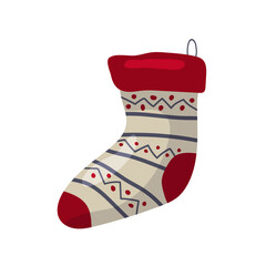 Decorative holiday stocking with red accents and intricate patterns hanging on display