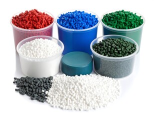Colorful plastic pellets in containers, showcasing various colors and textures against a white backdrop