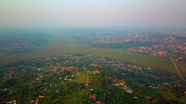 Nabajuzi River And City Of Masaka At Dusk In Uganda, Africa. - aerial shot