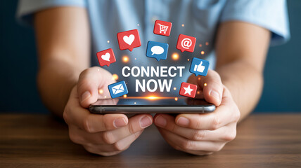 Person holding smartphone with social media icons and connect now text mobile phone hands