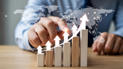 Person touching glowing upward arrow on financial graph with world map overlay business finance