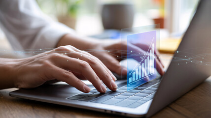 Person typing on laptop with glowing digital graph overlay and data streams Keywords: laptop, typing, hands, keyboard, graph, chart, data, digital