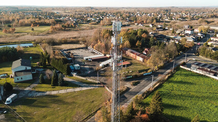 Telecommunication tower amidst countryside fields