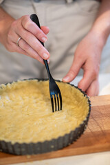 preparing the pastry shell for a frangipane tart