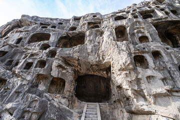 Longmen Grottoes in Luoyang, China, stone carved Buddha statues, ancient historical relics