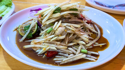 Spicy papaya salad with salted crab and fermented fish