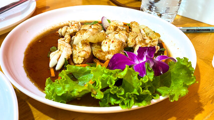 Spicy Thai squid roe salad, bold flavors, authentic Thai cuisine.