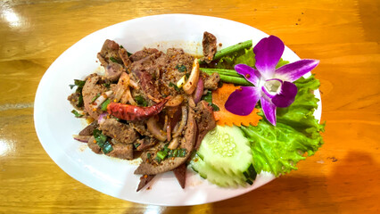 Pork Liver Spicy Salad (Thai Food) , traditional Isan cuisine from Thailand.