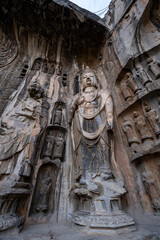 Obraz premium Longmen Grottoes in Luoyang, China, stone carved Buddha statues, ancient historical relics