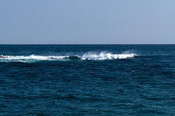 tranquil seascape with breaking waves in winter