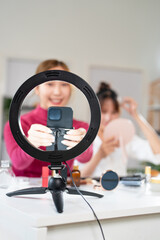 Social media influencer, beauty blogger and brand ambassador doing makeup review, marketing and...