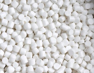 Close-up of numerous small, uniformly-sized white cylindrical objects