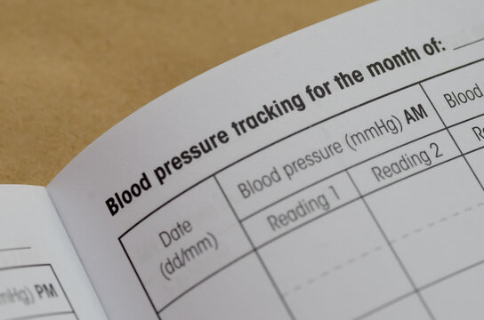 The document shown is a medical log designed for "Blood pressure tracking," allowing a user to record their readings.