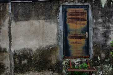 Old Rusty Door with Weathered Wall Texture