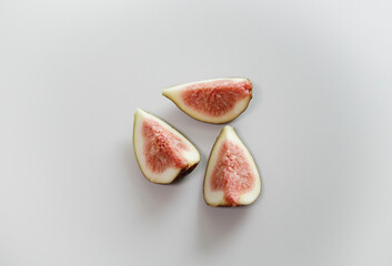 Slices of Fresh Figs on White Background