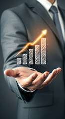 A businessman holding a rising bar graph with an arrow in his hand wearing a suit and tie