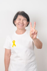 Elderly with Yellow Ribbon for concept of yellow September, Suicide prevention day, Childhood, July...