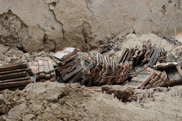 Old roof tiles on the ruins