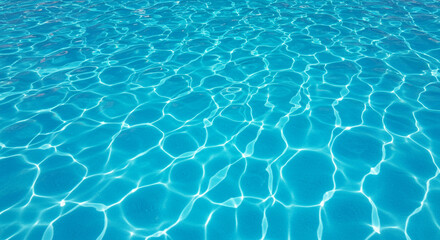 Sunlight creating bright ripple patterns on the surface of clear blue swimming pool water in a relaxing summer scene.